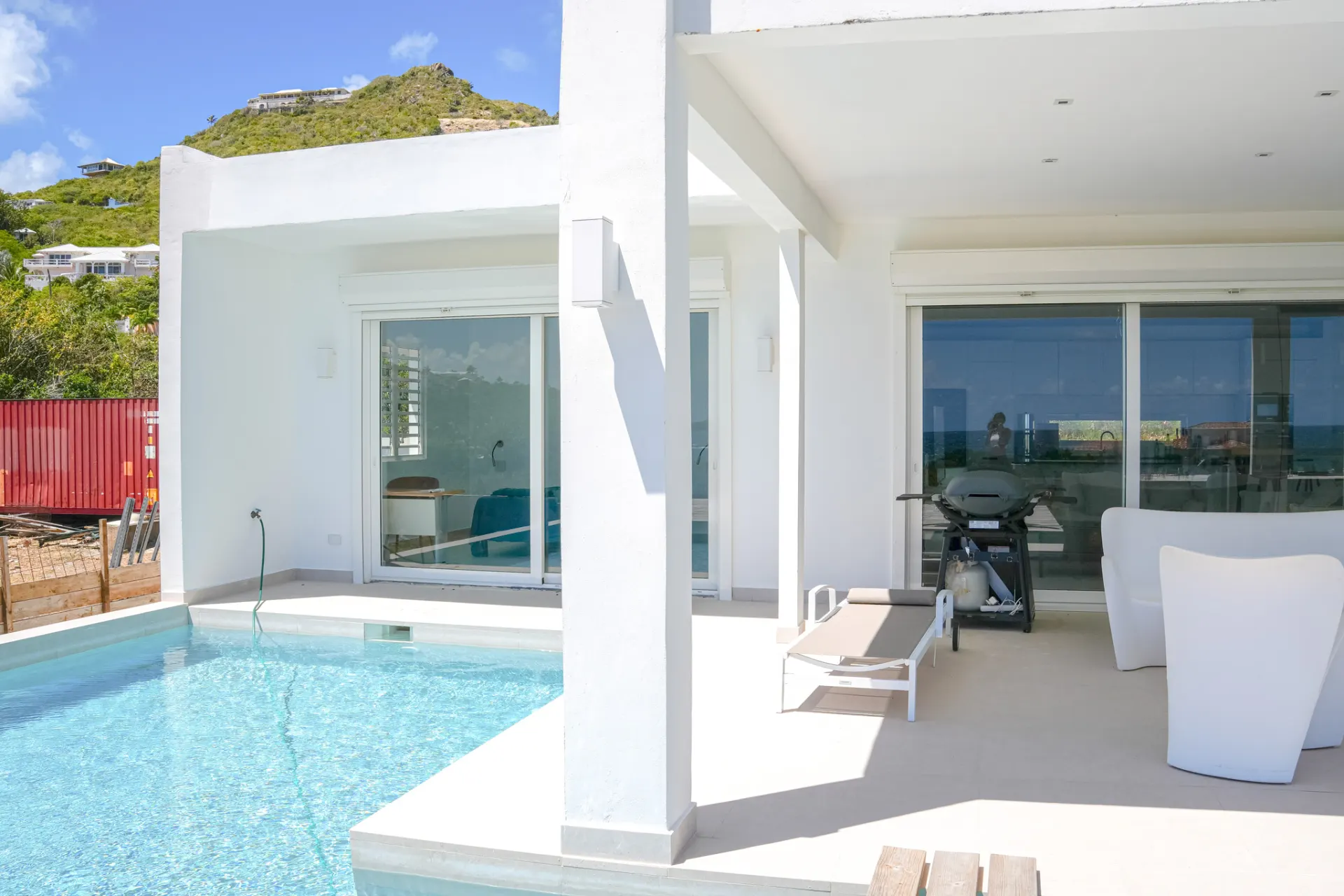 Terrace overlooking the pool and hills